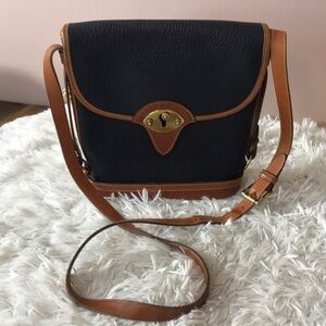 - Dooney & Bourke Cavalry Spectator Leather Crossbody Leather Bag